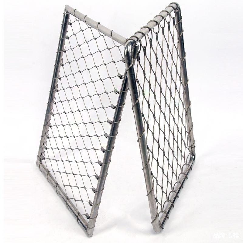 Two stainless steel rope mesh panels standing on edge